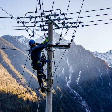 Maintenance workers ensure power supply in village in China's Yunnan