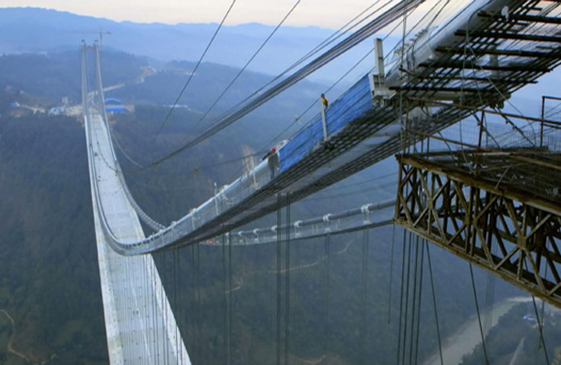 Sidewalks on SW China's Longjiang River highway suspension bridge