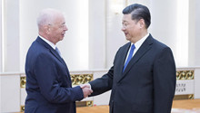 Xi meets Schwab, vows greater opening up