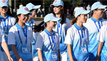 Volunteers seen on street in host city of 18th SCO Qingdao Summit