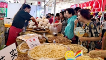 Asian pavilions packed with business deals