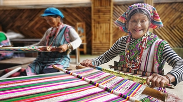 Women with facial tattoos lead a happy life in NW Yunnan