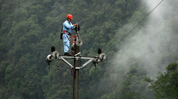 Lamps illuminate Dulong town in NW Yunnan