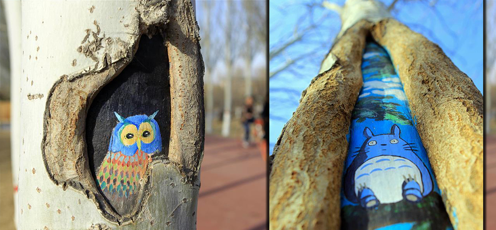 手绘“树洞画”添彩公园 